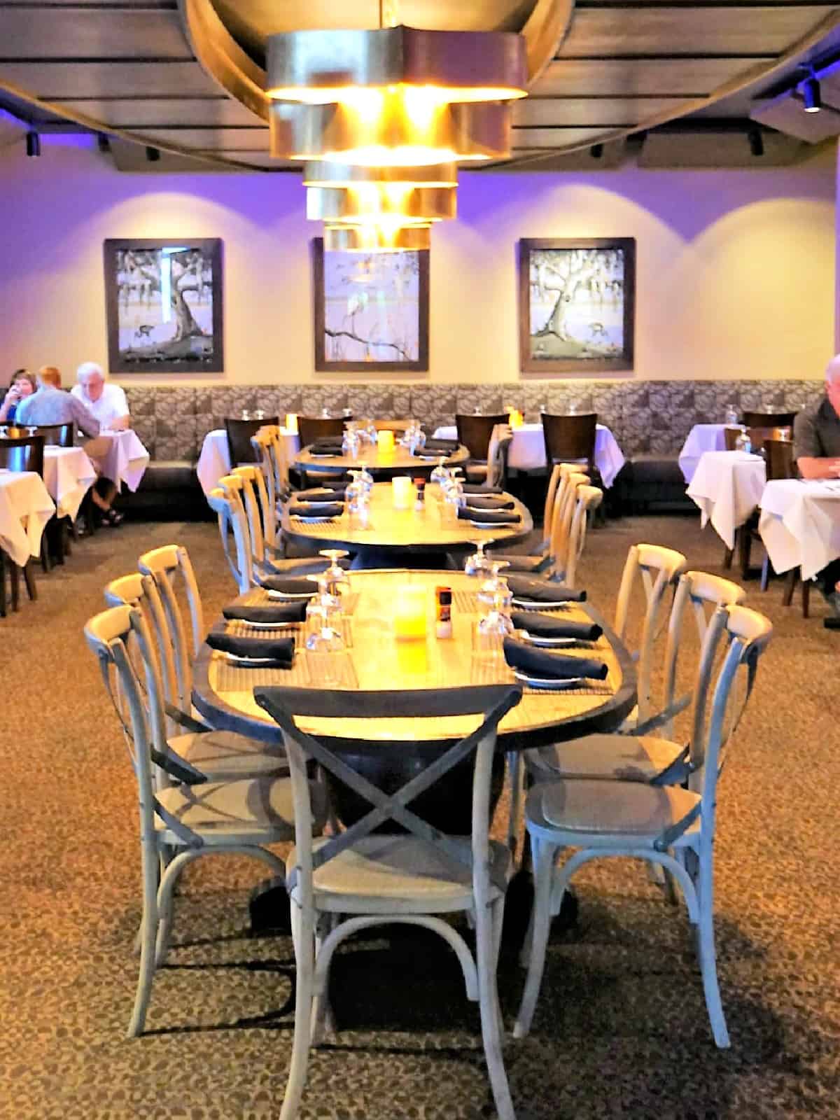 Indoor dining room with people dining.