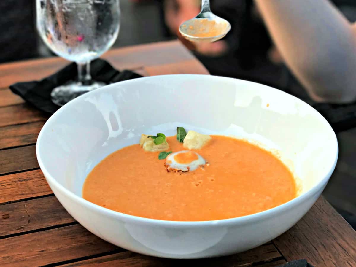 Lobster Bisque in a white bowl.
