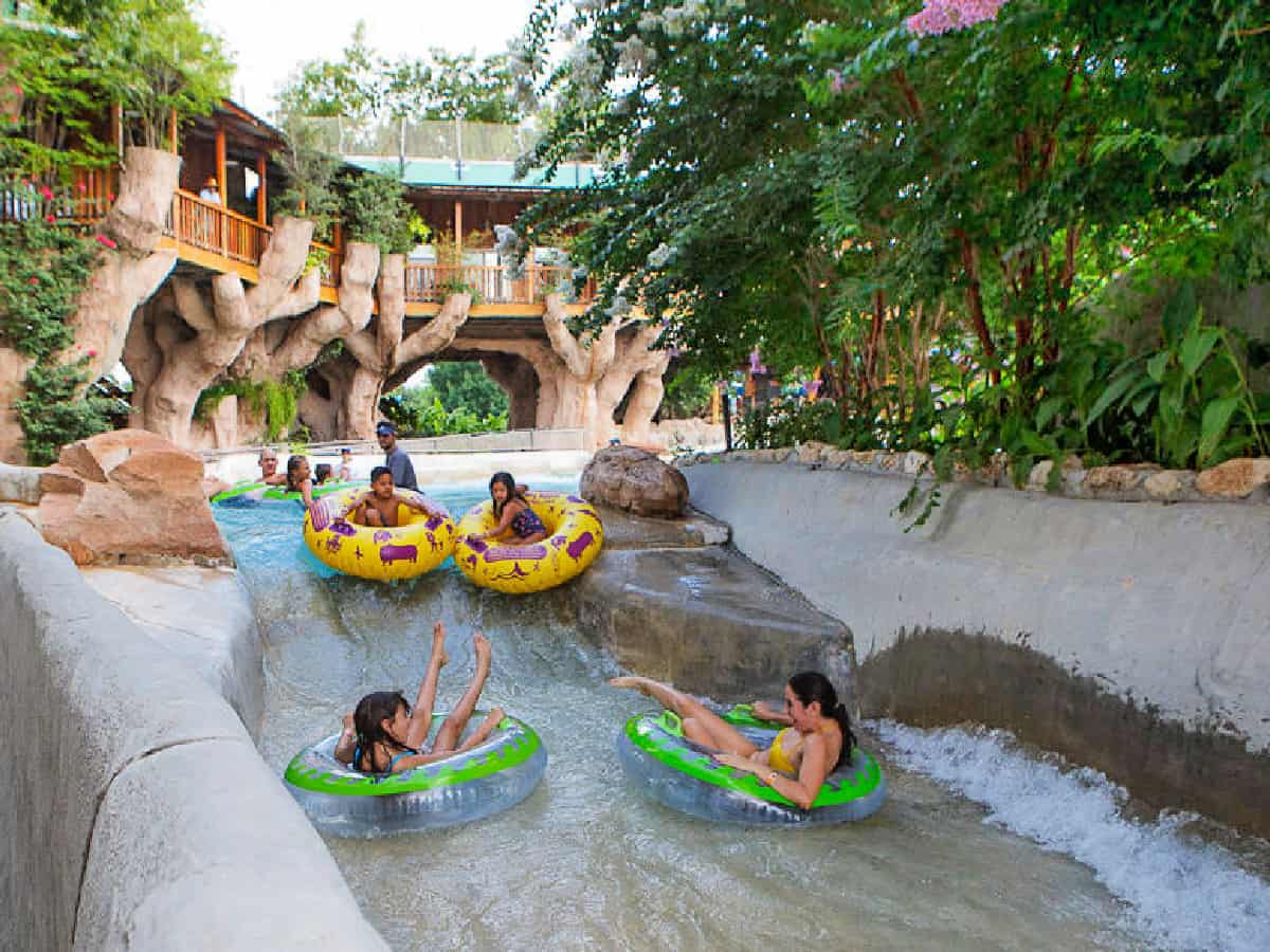 Schlitterbahn - The World's Best Water Park People on tubes sliding down river.
