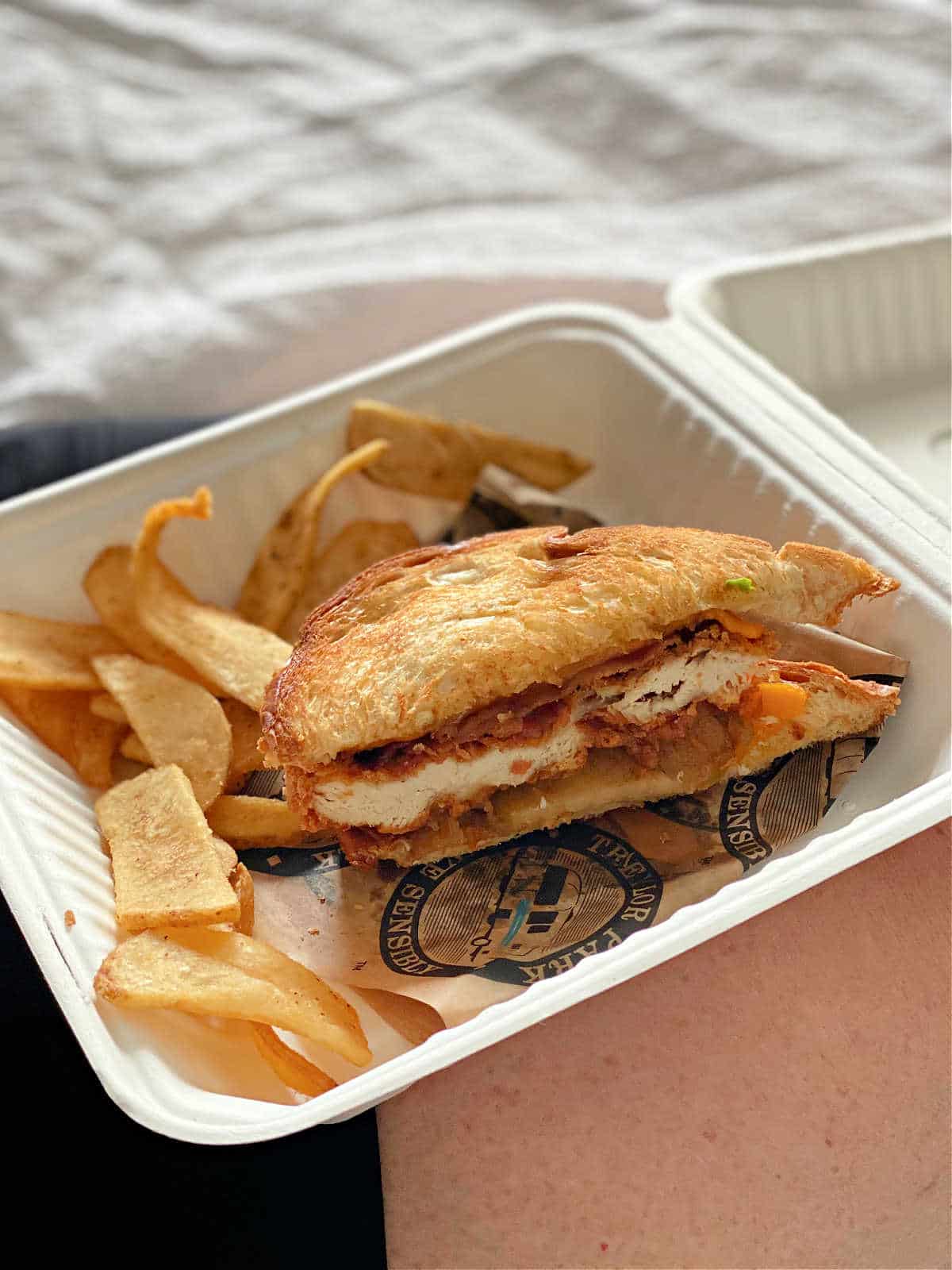 Grilled apple pie chicken sandwich served with golden toasted bread and savory filling.