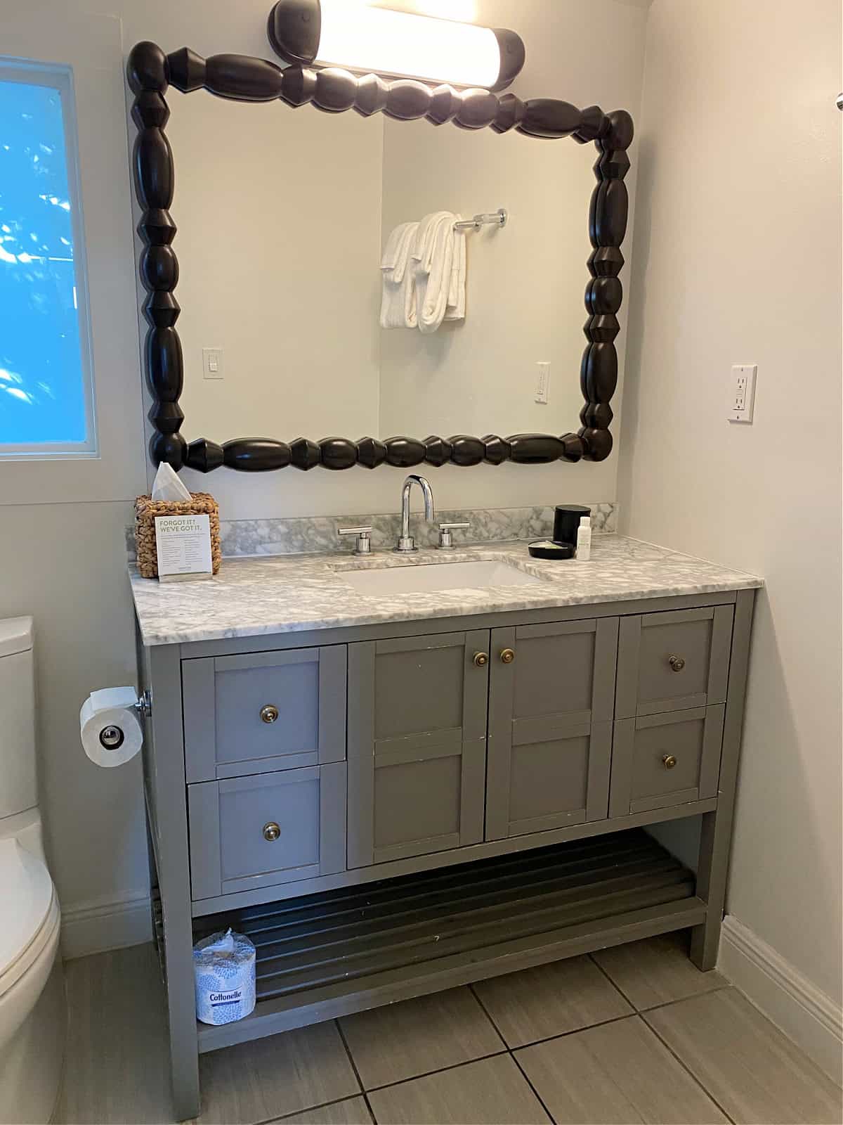 Bath vanity with large mirror.