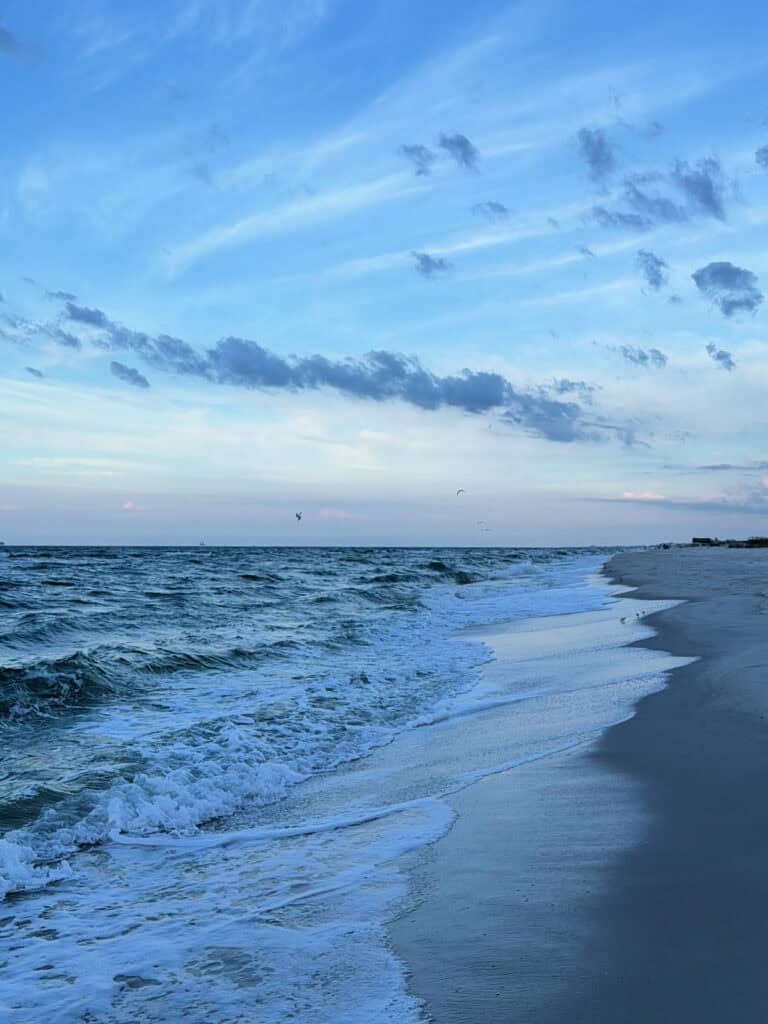 Waves of the ocean receding from the beach.