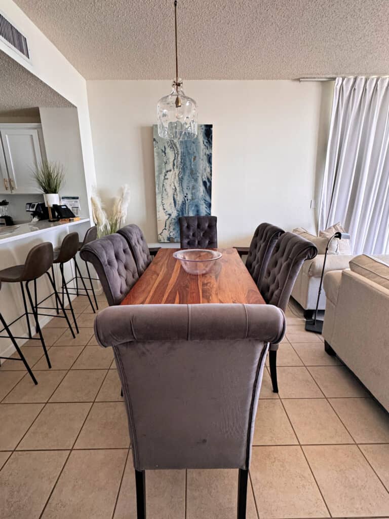 Dining table surrounded by six chairs.