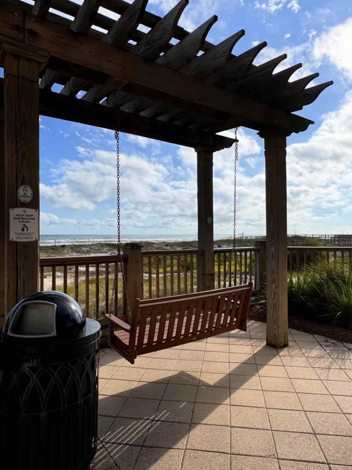 Wooden swing facing the Gulf of Mexico.