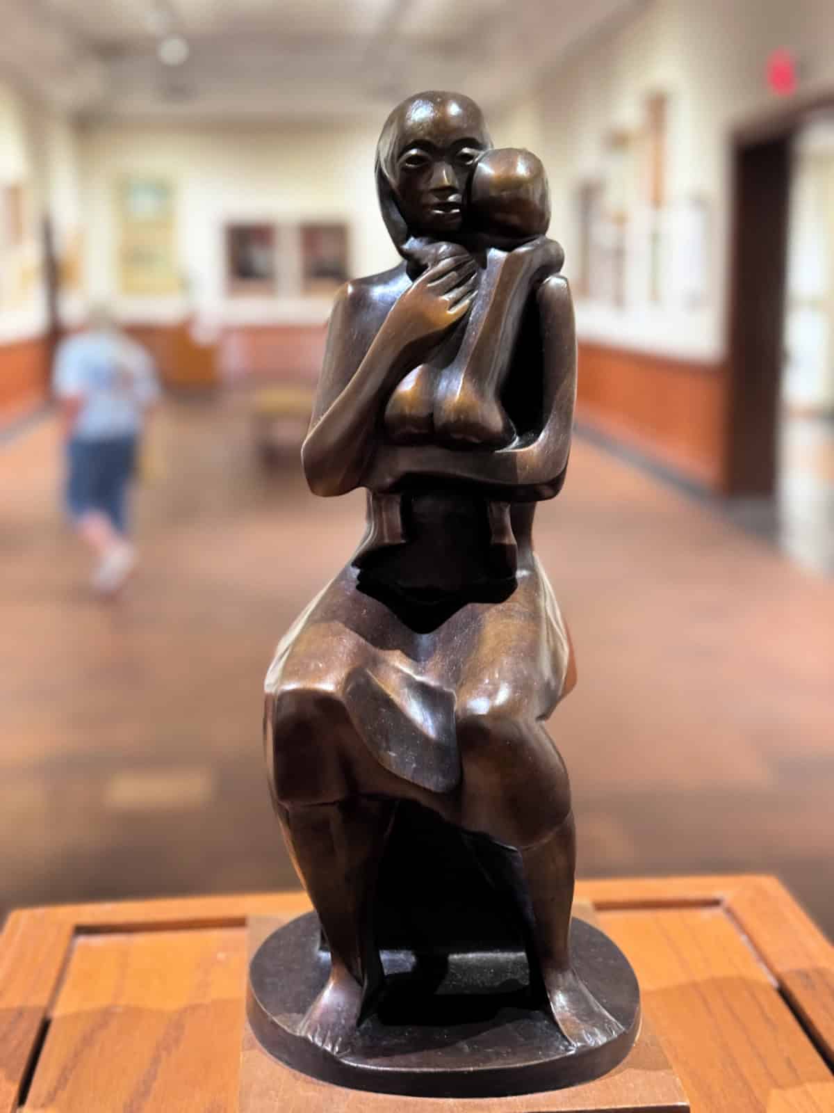 Sculpture of a woman holding her child.