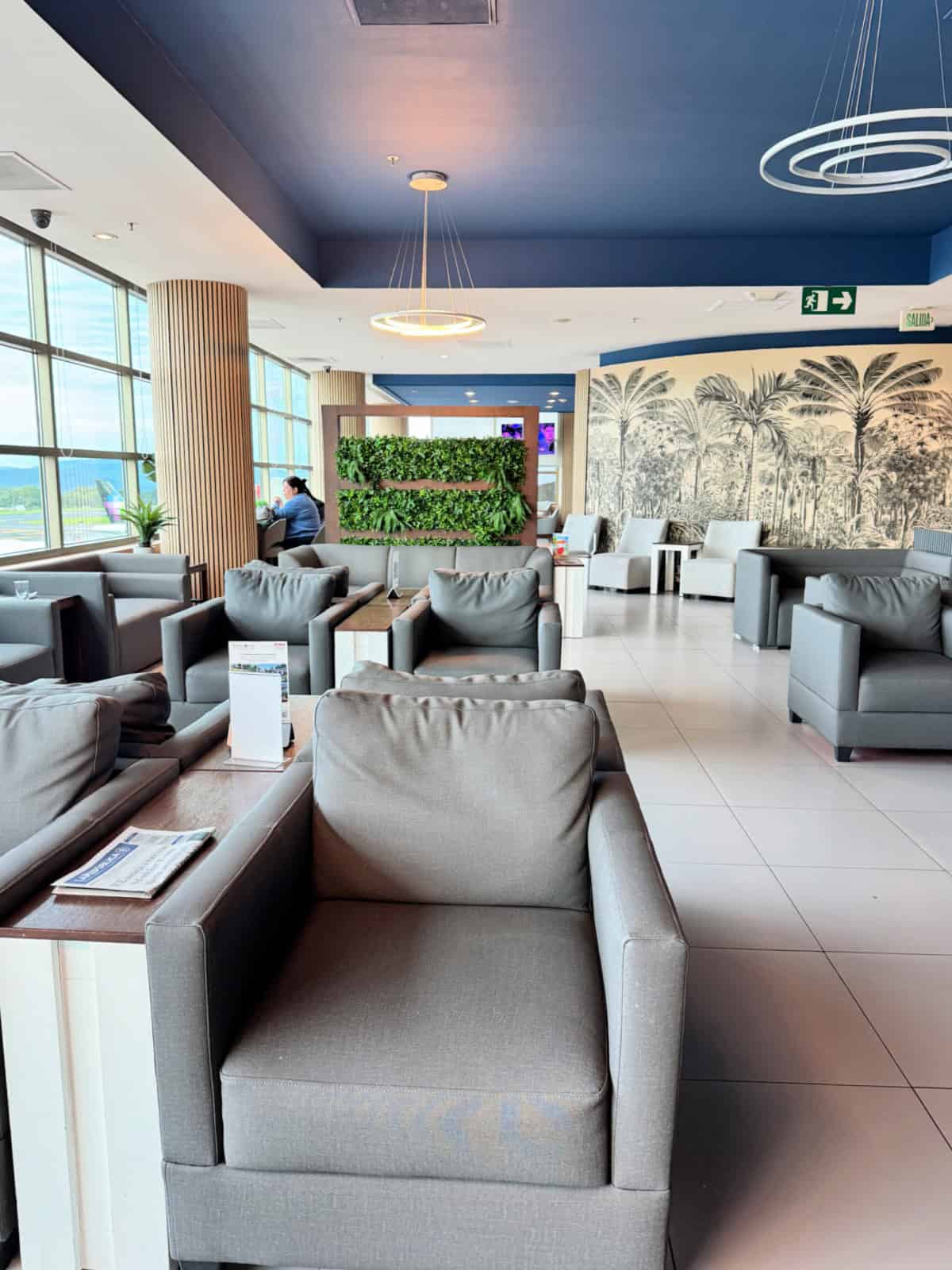 Seating area inside of a lounge at the SJO airport.