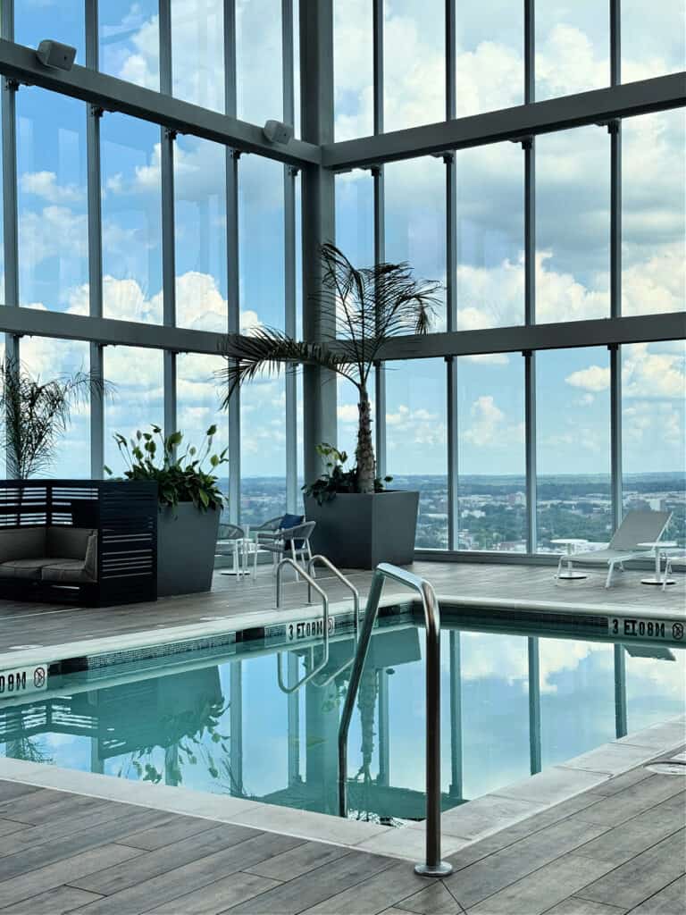 Small plunge pool on the 30th floor with views of the city in the background.