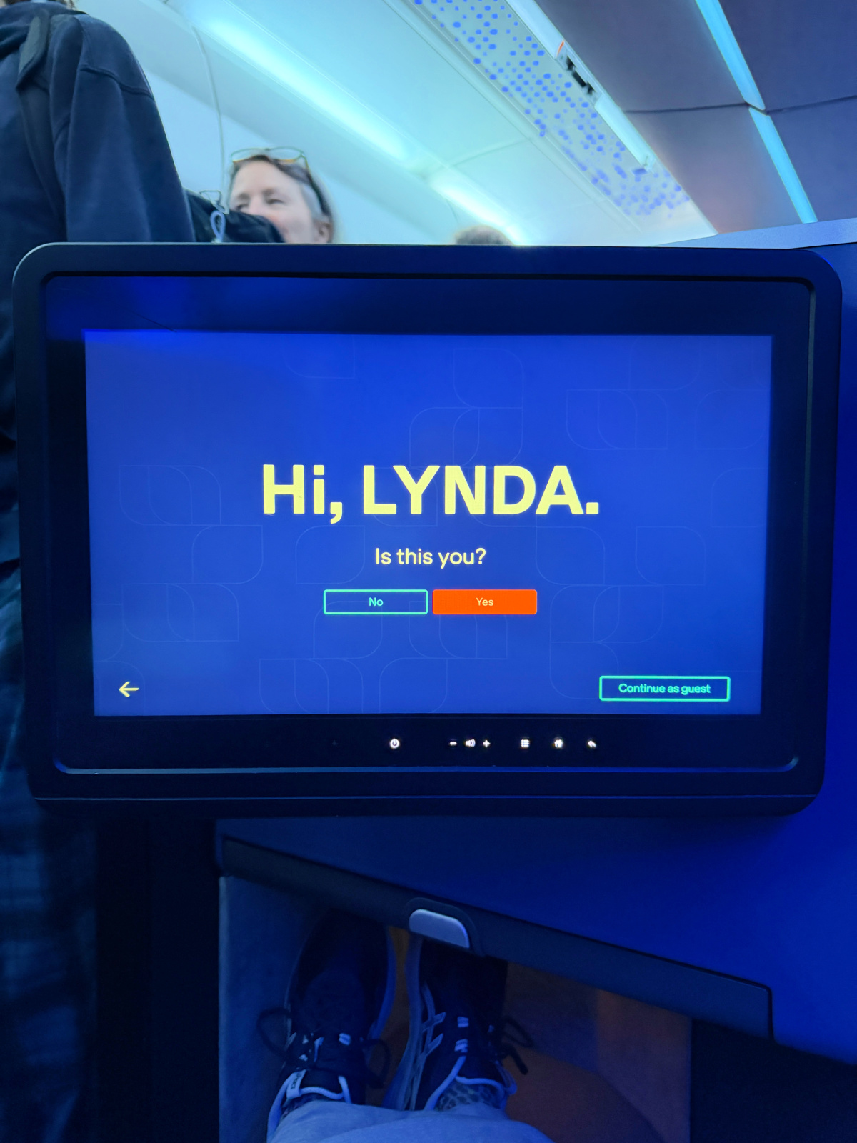 JetBlue Mint seatback entertainment screen displaying a personalized welcome message for the passenger.