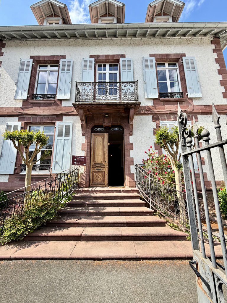 Hotel La Villa Esponda in Saint-Jean-Pied-de-Port, France, with stone steps, decorative iron railings, and traditional Basque architecture.