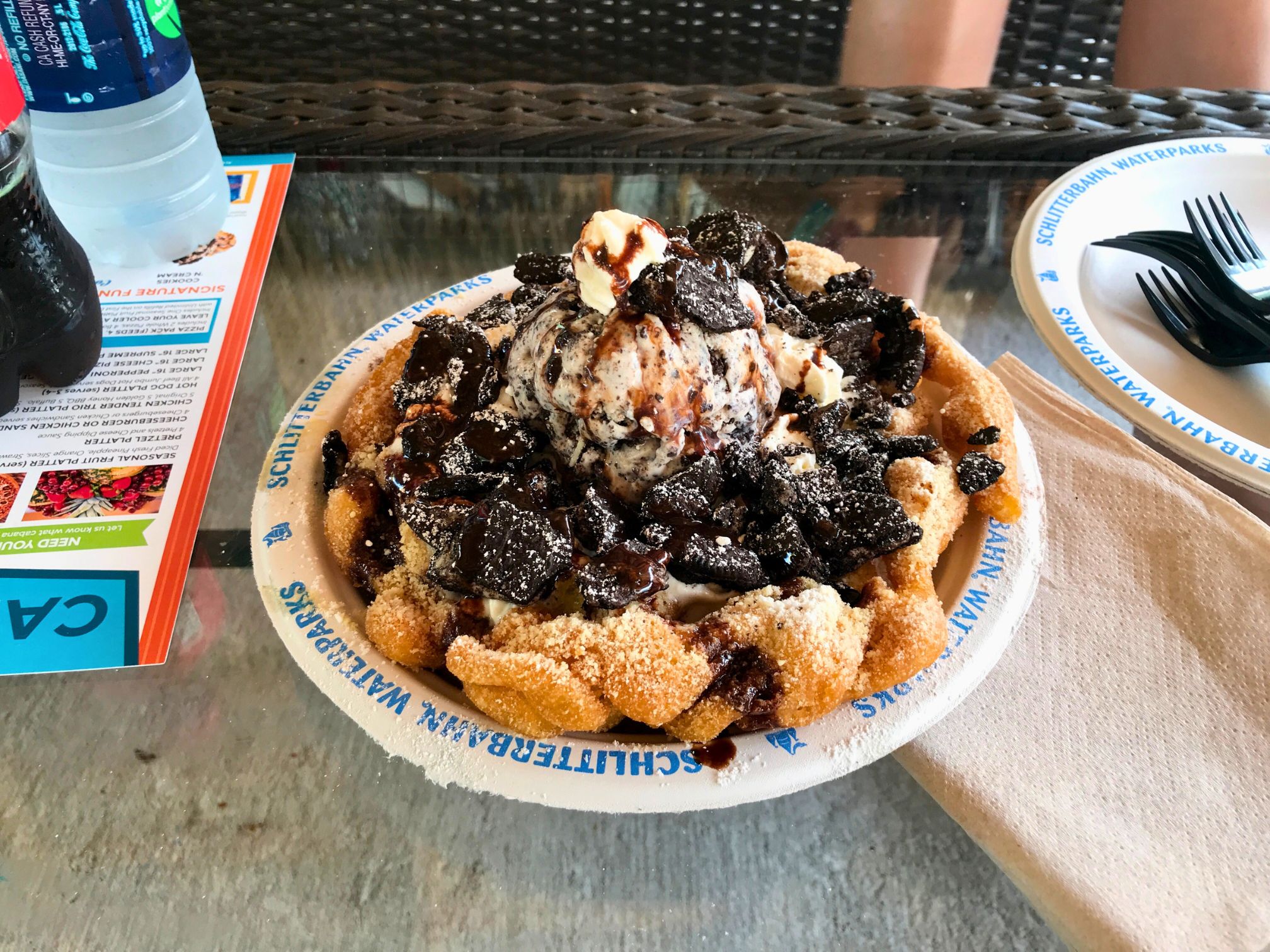 Schlitterbahn - The World's Best Water Park Oreo funnel cake topped with cookies-and-cream ice cream, crushed Oreo cookies, chocolate sauce, and powdered sugar at Schlitterbahn New Braunfels.