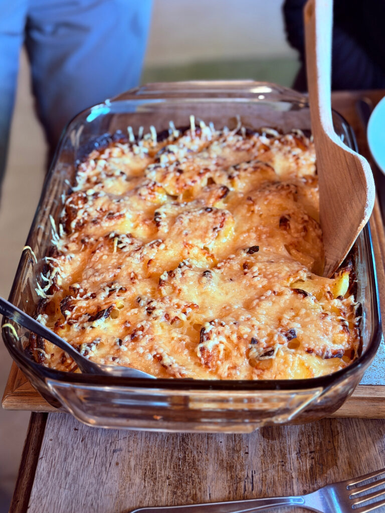 Cheesy baked potato casserole served as part of the communal dinner at Auberge Borda.
