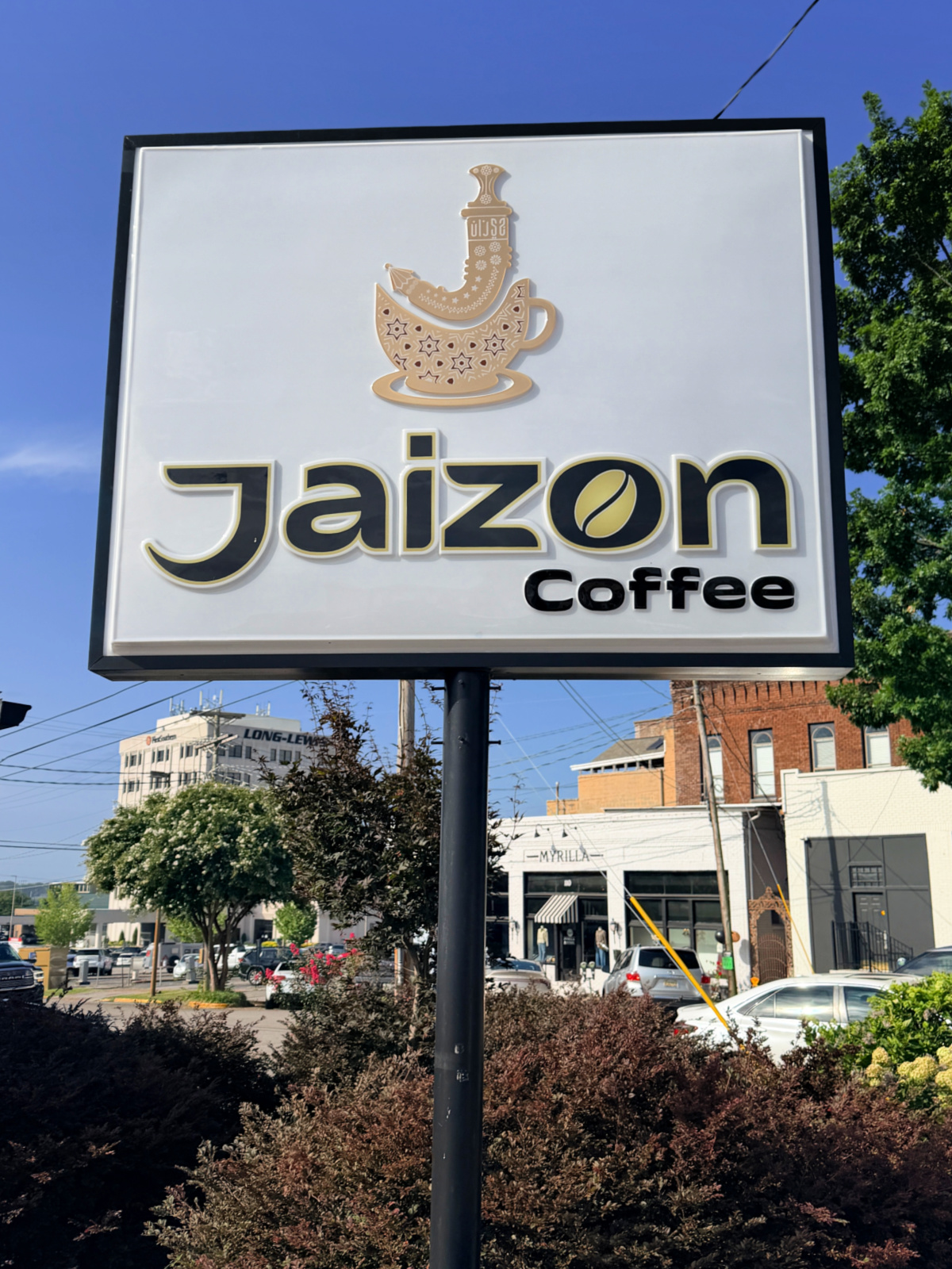 Sign outside Jaizon Coffee in downtown Florence, Alabama, a coffee shop specializing in Middle Eastern-inspired coffee and pastries.