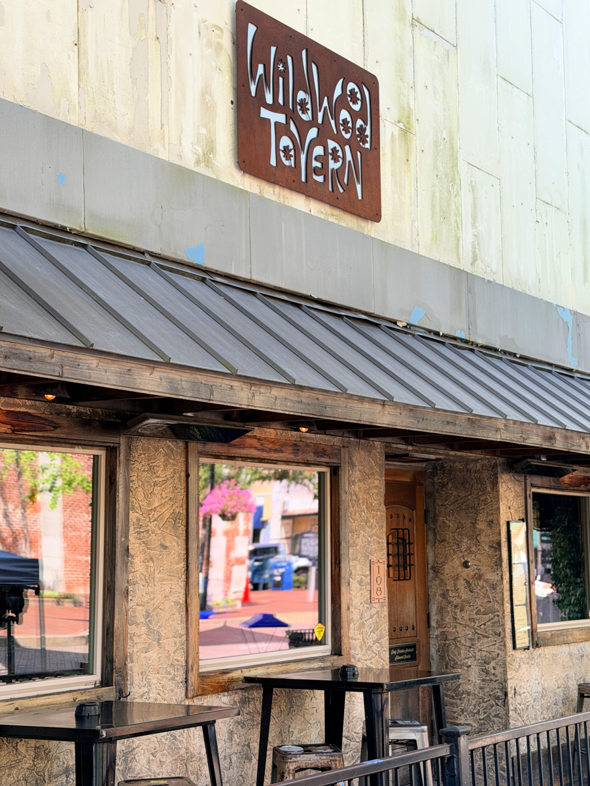 Exterior of Wildwood Tavern, a downtown Florence, Alabama restaurant known for its casual atmosphere, burgers, sandwiches, and craft beer selection.
