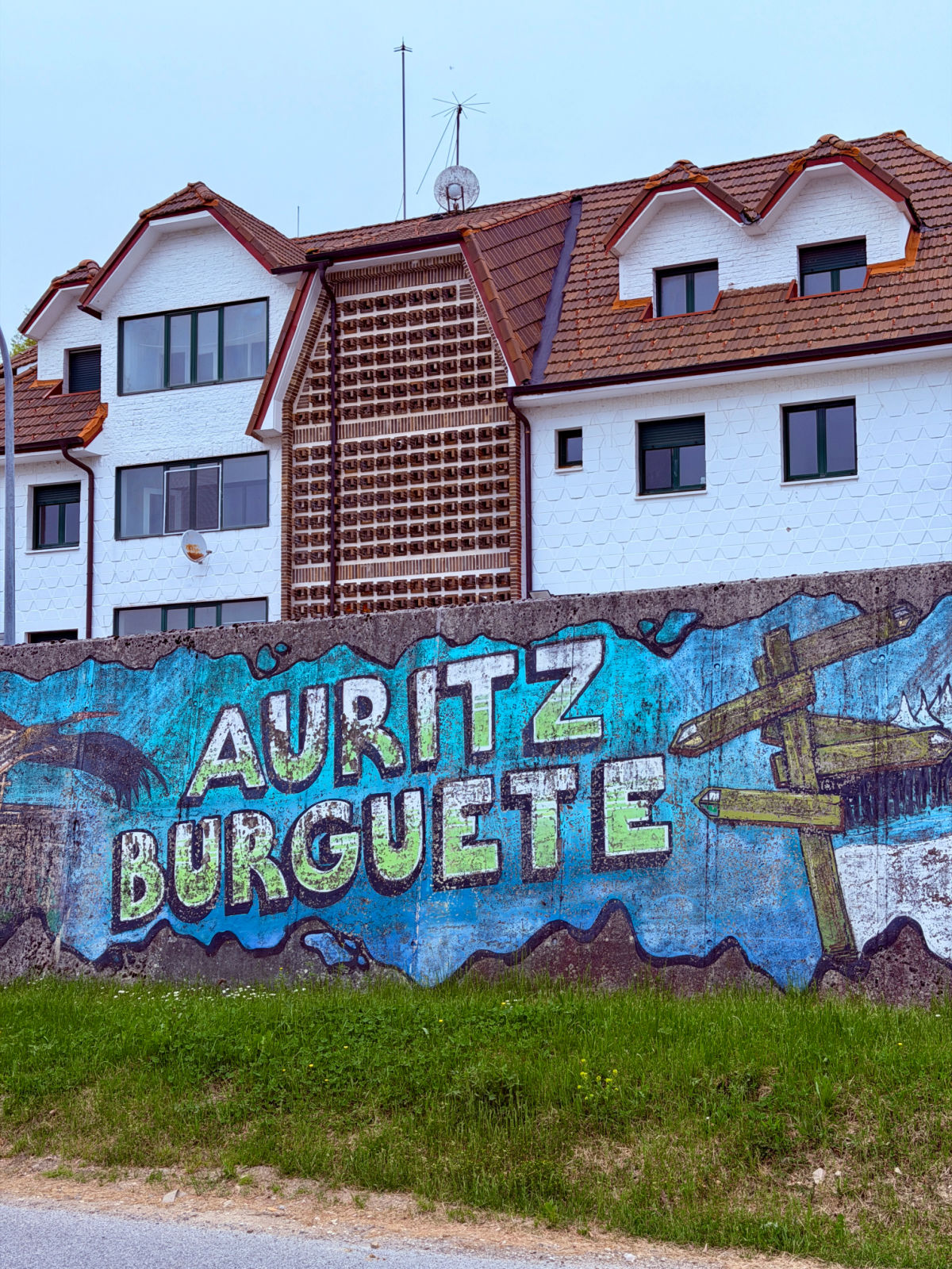 Colorful Auritz Burguete mural painted on a wall in the village.