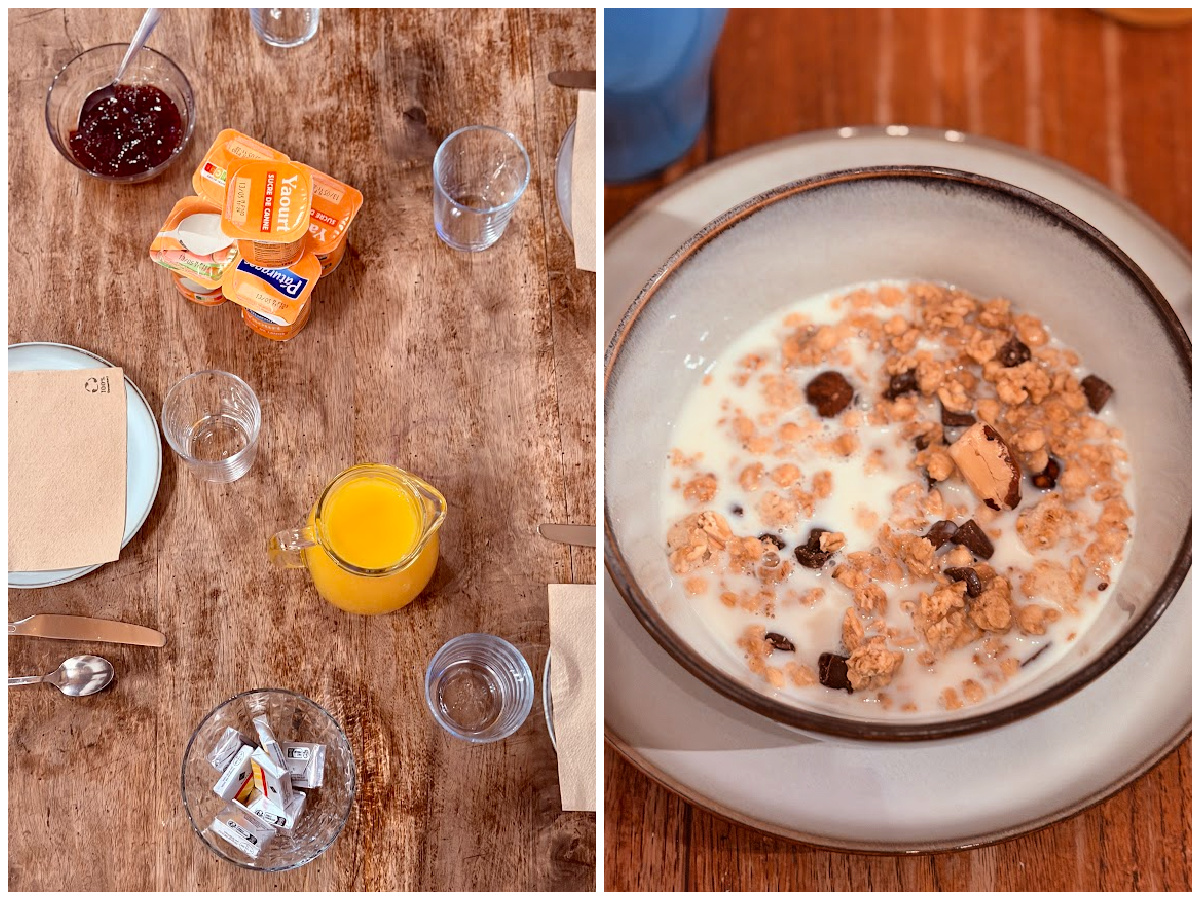 Breakfast table with orange juice and yogurt alongside a bowl of granola and milk at Auberge Borda.