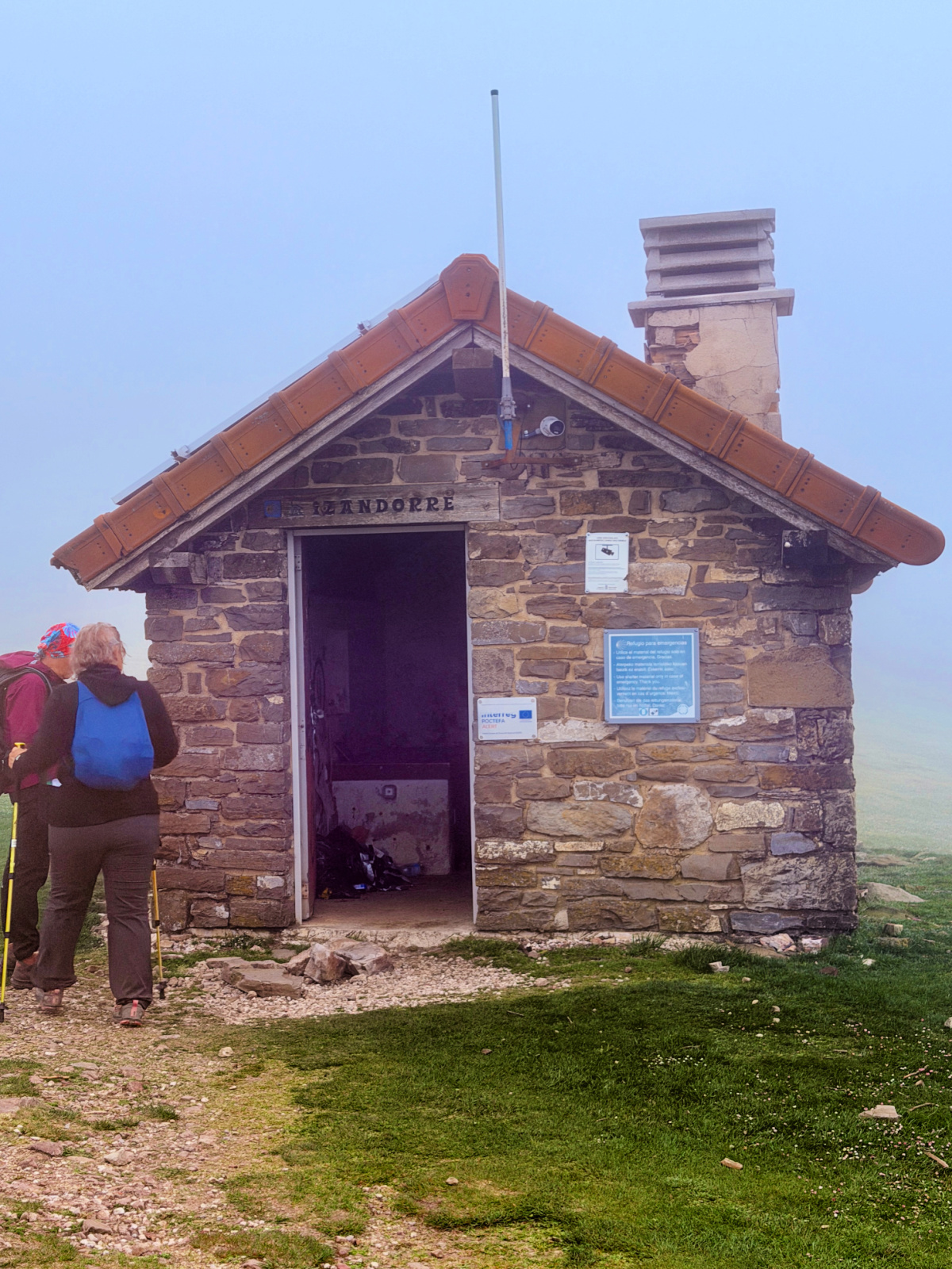 Stone emergency shelter in the fog along the Napoleon Route through the Pyrenees.