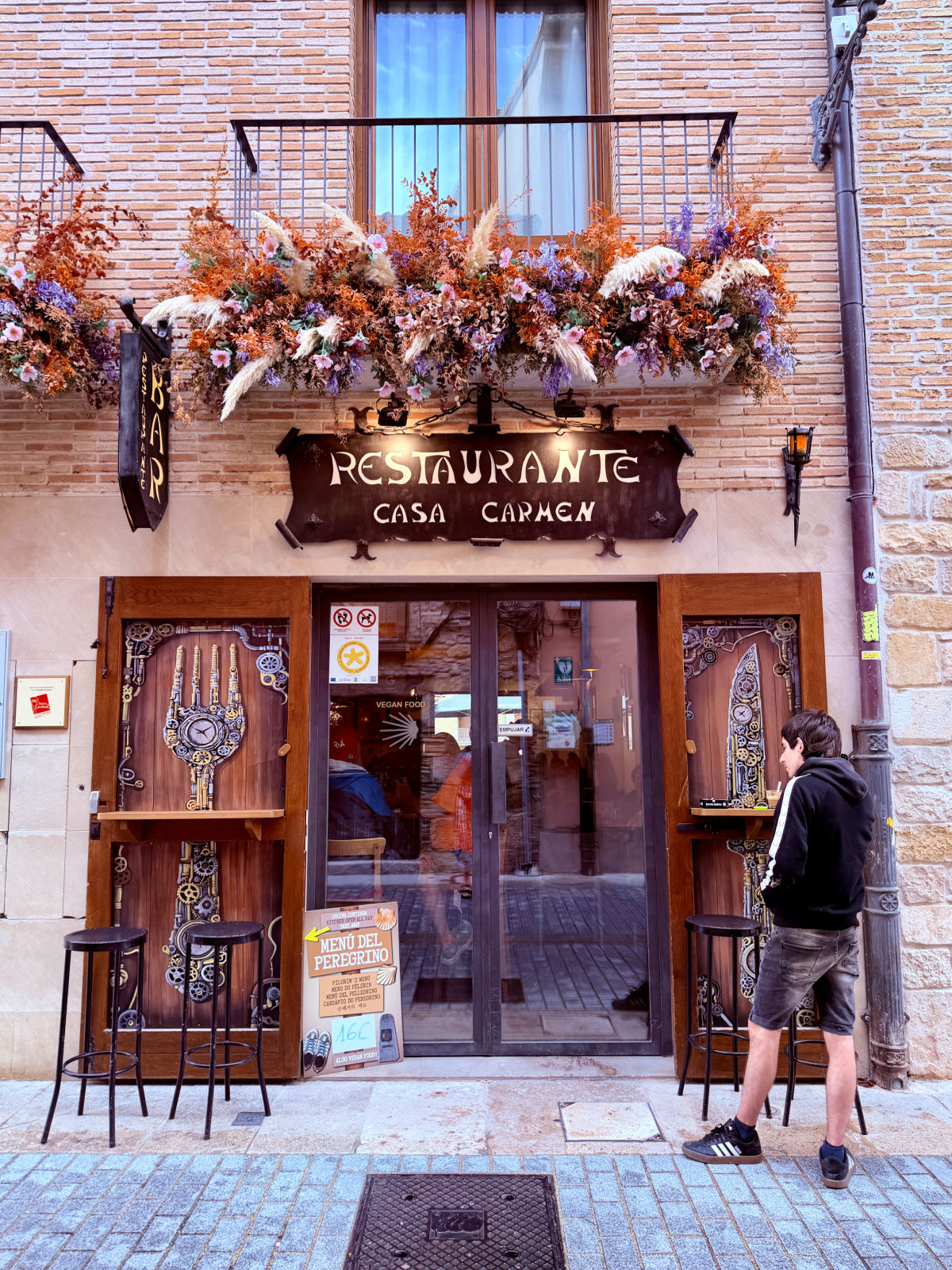 Entrance to Casa Carmen restaurant on a narrow street in Estella, Spain.