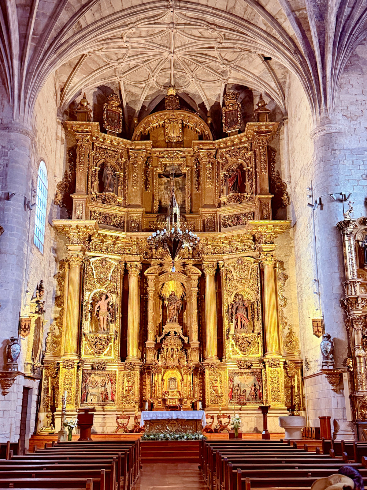 Ornate gilded altarpiece inside the Church of Santiago in Puente la Reina.