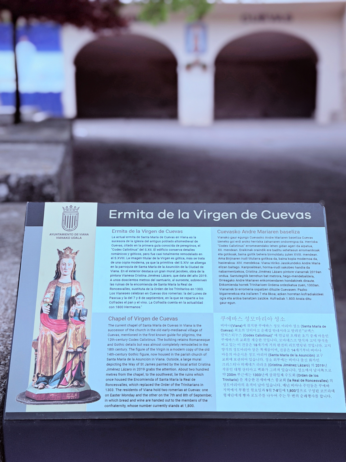 Informational sign for the Ermita de la Virgen de Cuevas near Viana, Spain.