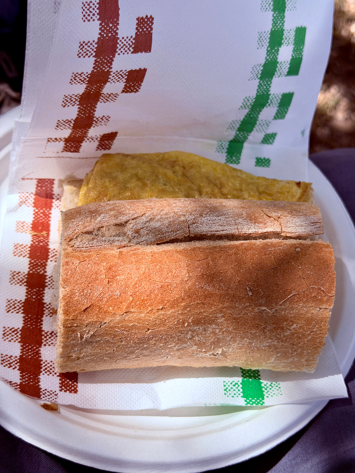 Fried egg served on crusty bread at a Camino food stop.