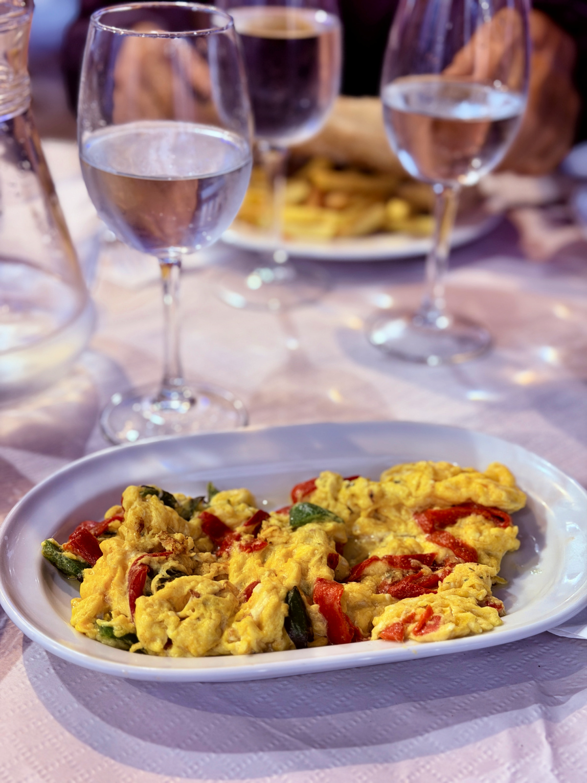 Plate of scrambled eggs with peppers served for dinner in Spain.