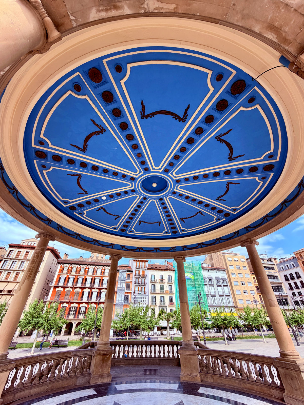 Blue decorated ceiling inside the central gazebo at Plaza del Castillo in Pamplona.
