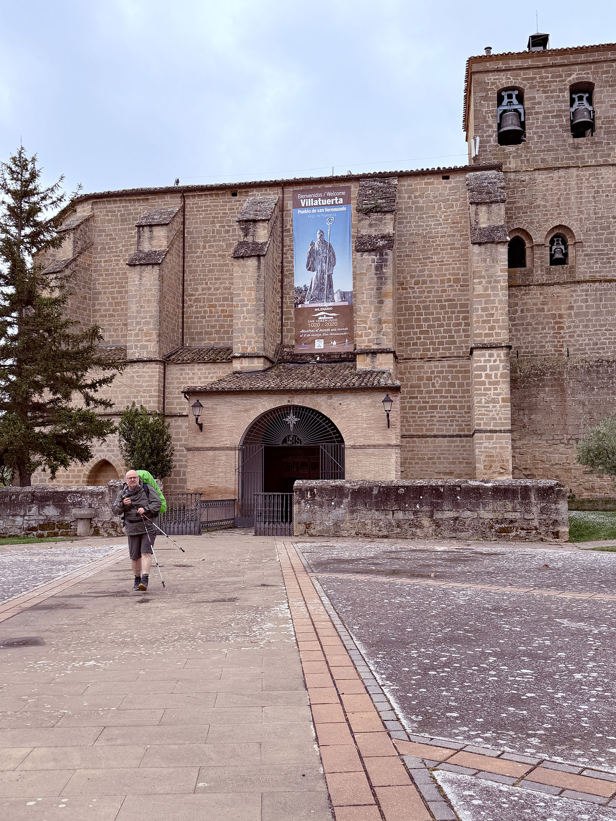 Historic stone church overlooking the plaza in Villatuerta, Spain.
