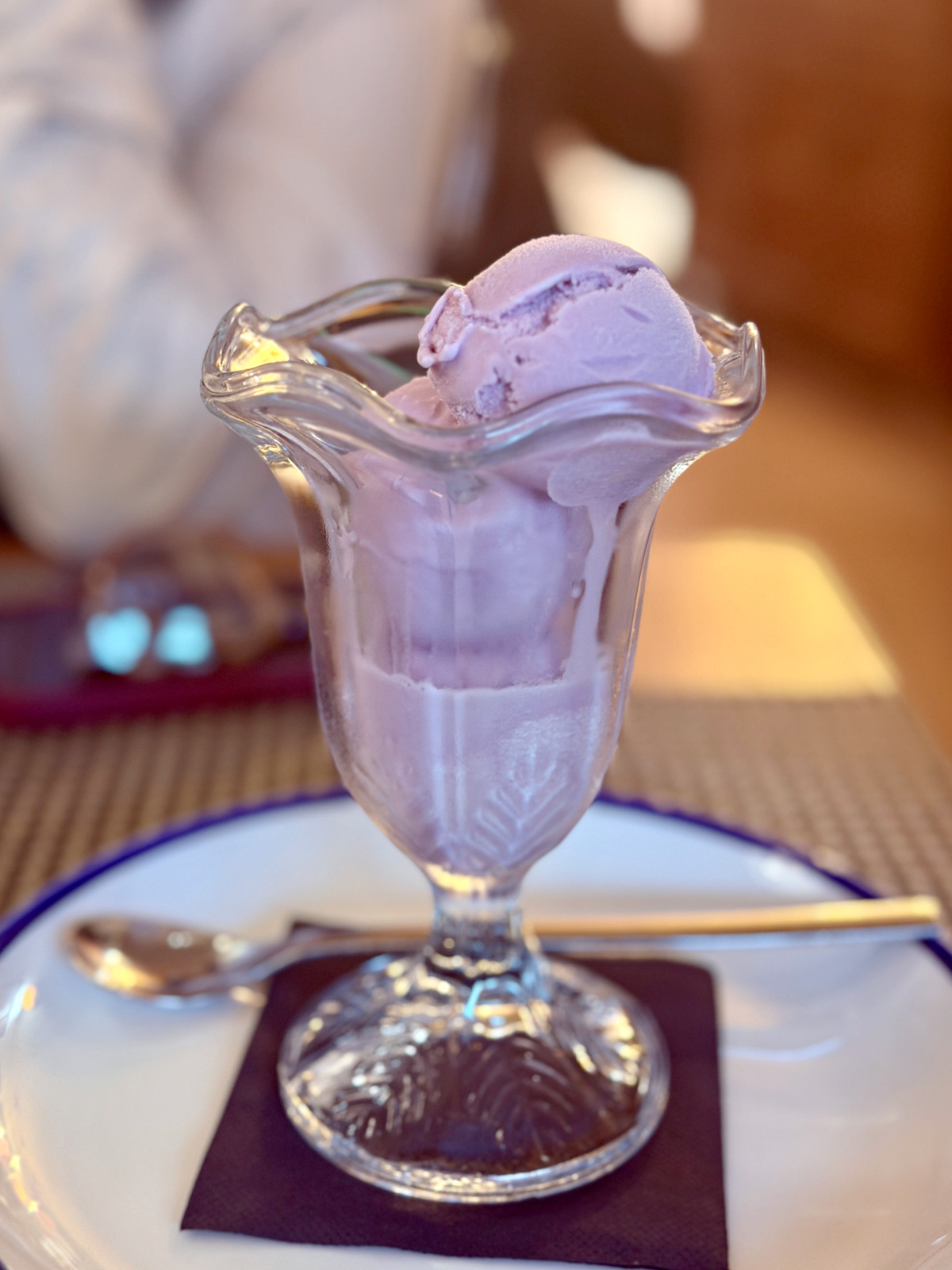 Glass dish filled with pale purple violet ice cream.